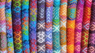 arrangement of colorful knitted fabrics